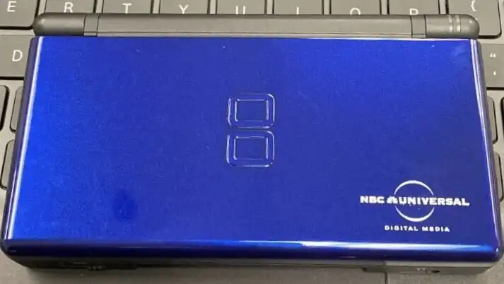 Nintendo DS Lite Cobalt NBC Universal Digital Media Console